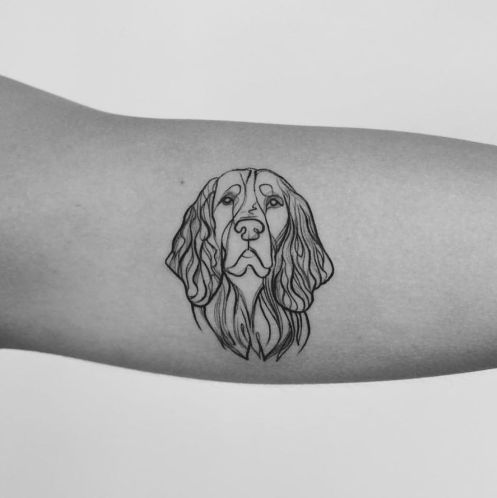 Dog paw print tattoo with white ink  Dog memorial tattoos Paw print tattoo  Memorial tattoos